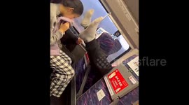 Man takes off shoes and puts feet in face of fellow passenger after reclining seat dispute on Chinese train