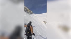 Skier is swept away by avalanche - but survives thanks to airbag