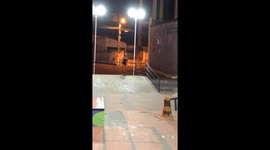 Skateboarder Falls Backward Onto Rail
