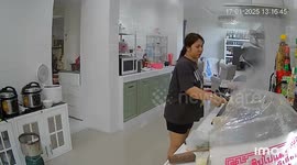 Housewife puts out frying pan fire... only for it to keep reigniting