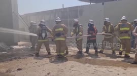 Firemen tackle nightclub inferno that killed two workers and injured five others