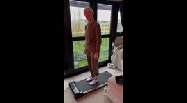 Grandmother struggles to get to grips with moving treadmill
