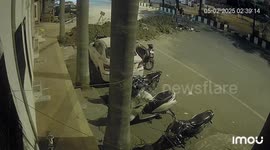 Indian rickshaw driver crashes into pile of earth from roadworks