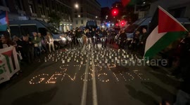 On the ground the words ‘stop genocide’ were composed with small candles lit during the demonstration in response to the international appeal #StopEmbassies on the ‘Friday of Rage’ for Gaza in Rome.