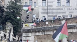 Protesters wave Palestinian flags during the demonstration in support of the Palestinian people organized close to Remembrance Day by various Palestinian associations in Rome.