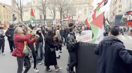Marching protesters wave Palestinian flags during the demonstration in support of the Palestinian people organized close to Remembrance Day by various Palestinian associations in Rome.