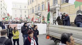 Marching protesters wave Palestinian flags during the demonstration in support of the Palestinian people organized close to Remembrance Day by various Palestinian associations in Rome.