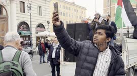 Maya Issa, leader of the Palestinian Student Movement in Italy, speaks to protesters during the demonstration in support of the Palestinian people organized close to Remembrance Day by various Palestinian associations in Rome.
