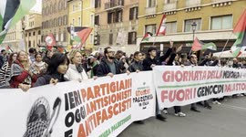 Marching protesters wave Palestinian flags during the demonstration in support of the Palestinian people organized close to Remembrance Day by various Palestinian associations in Rome.