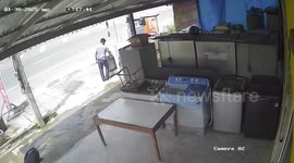 Washing machine repairman leaps away from car hurtling into shop