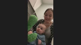 Adorable baby goes from hating to adoring dancing cactus toy over time