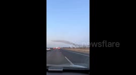 Motorist left in awe by ethereal 'wave' of birds twisting and turning in sky