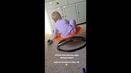 Adorable girl hilariously falls over after spinning too much on her sensory seat