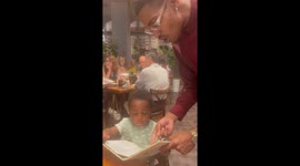 Little boy impresses as a gentleman during first restaurant visit with mom