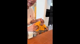 Baby panics thinking tape will be put on his mouth, grandpa consoles him