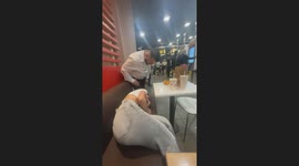 Man's concern startles a tired woman sleeping at McDonald's
