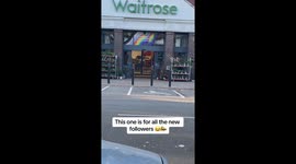 Man sneakingly pranks people with a megaphone as they leave the store