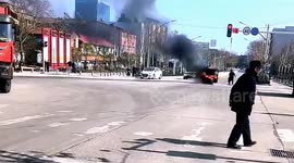 Tricycle engulfed in flames drives through street in China