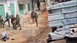 Israeli forces evacuate families from their homes in the Al-Fara refugee camp