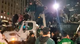 US: Eagles Fans Climb Onto Trash Truck To Celebrate Super Bowl Win