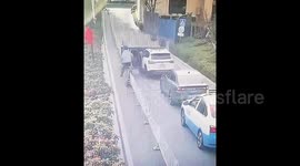 Car crashes through barrier gate before crashing into vehicles after driver forgot to engage handbrake