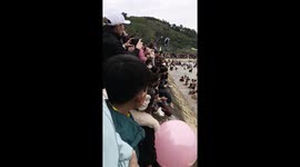 Hundreds take part in barehand fishing contest where whoever catches the most wins