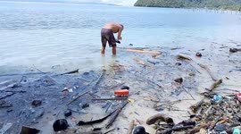 Tourists and locals devastated as Indonesian island's once crystal-clear waters now littered with waste