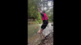 Rope swing snaps over river while husband takes a swing