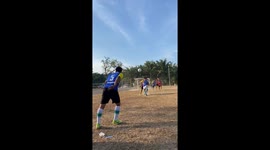 Striker falls over but still scores with a wicked deflection with his bottom