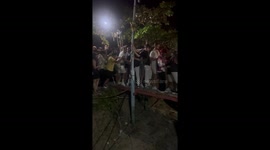Tourist cram onto narrow wooden walkway for Full Moon Party in Thailand