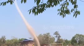 Huge dust devil tornado tears through pitch during football match
