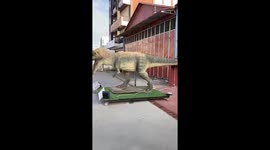 This house had a dinosaur for sale outside the driveway