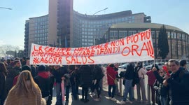 Protesters hold up a banner with the slogan 'Mental health can't wait any longer: release the funds now!!!' during the demonstration organized by the associations of the regional mental health network in front of the headquarters of the Lazio Region in Ro