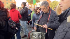 A protester plays a drum during the demonstration organized by the associations of the regional mental health network in front of the headquarters of the Lazio Region in Rome.