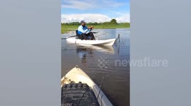 Angler catches huge 6.5ft fish using tiny rod in kayak