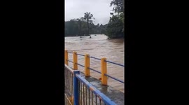 Search and rescue team swept away by raging floods in Indonesia