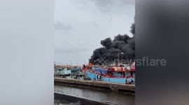 Fishing trawler catches fire while docked in Indonesia