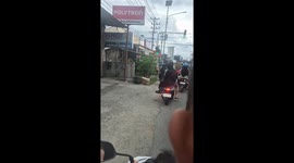Motorcycle rider carries 3ft tall DURIAN on the back of his bike