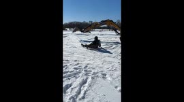 Snow Revelers Craft Makeshift Ride With An Excavator And Cart Top