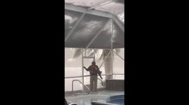Florida Man Removes Snow From Pool Screen