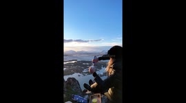 Hot Cocoa with a View – A Cozy Moment on a Snowy Mountain Peak