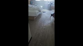 Water leak from the ceiling floods hotel room in Indonesia