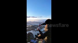 Best view ever? Hiker drinks hot cocoa sitting on top of picturesque mountain in Norway