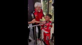 Italian motorbike racing legend poses with young super fan in Thailand