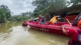 Philippine Red Cross volunteers rescue residents from floods