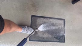 Satisfying process of cleaning a floor mat with pressure washing