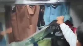 Feral passengers smash train window as they try to reach bathing festival in India