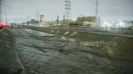 US, Los Angeles: Lincoln Heights Los Angeles River Rages With Storm Runoff