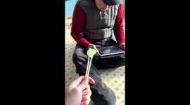Hilarious moment youngster pranks grandfather with sticky candy in China