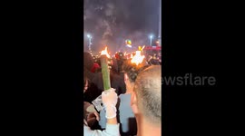 Young man's hair set on fire during torch-carrying festival in China